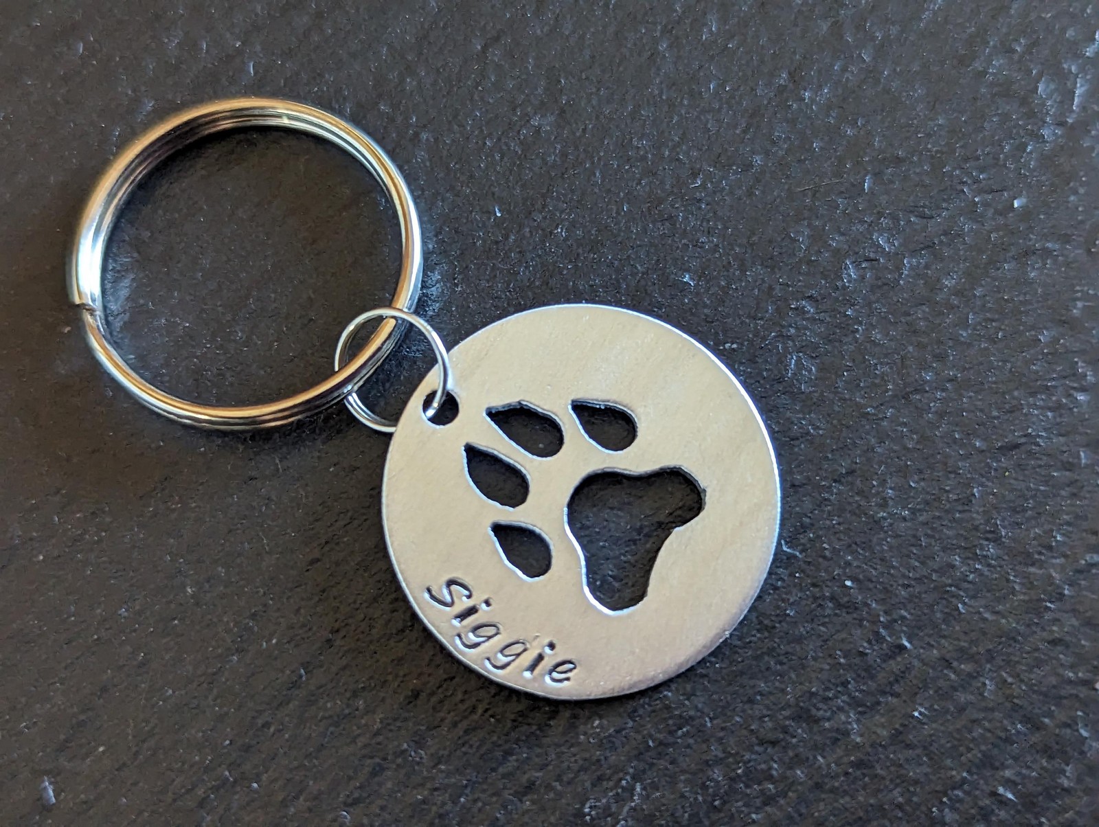 Sterling silver dog tag with paw print cut out – handmade and customized